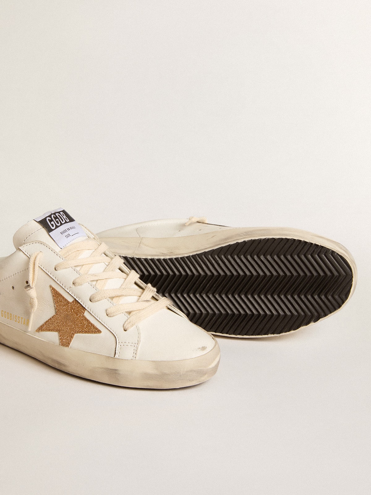 Super-Star Sabots in leather with plasticized gold glitter star